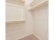 Walk-in closet has rods and shelves for maximum storage potential at 24153 W Hilton Ave, Buckeye, AZ 85326