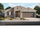 Single-story house with a two-car garage and landscaped front yard at 24356 W La Salle St, Buckeye, AZ 85326