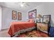 Bedroom with orange bedding and ceiling fan at 25227 S Mohawk Dr, Sun Lakes, AZ 85248