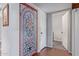 Inviting hallway with stained glass feature and hardwood floors at 25227 S Mohawk Dr, Sun Lakes, AZ 85248