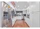 Modern kitchen with stainless steel appliances and white cabinets at 25227 S Mohawk Dr, Sun Lakes, AZ 85248