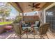 Covered patio with wicker furniture and ceiling fan at 25227 S Mohawk Dr, Sun Lakes, AZ 85248