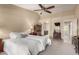 Spacious bedroom with ceiling fan and ensuite bathroom access at 25432 S Queen Palm Dr, Sun Lakes, AZ 85248