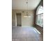 Dining room with stylish chandelier and tiled flooring at 25432 S Queen Palm Dr, Sun Lakes, AZ 85248
