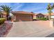 Tan house with tile roof, garage, and driveway at 25432 S Queen Palm Dr, Sun Lakes, AZ 85248