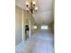 Inviting living room features high ceilings and archway leading to the kitchen at 25432 S Queen Palm Dr, Sun Lakes, AZ 85248