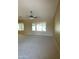 Bright living room with large windows and neutral carpet at 25432 S Queen Palm Dr, Sun Lakes, AZ 85248