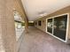 Extended covered patio with stamped concrete and ceiling fans for outdoor living at 25432 S Queen Palm Dr, Sun Lakes, AZ 85248