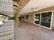 Spacious covered patio with stamped concrete and ceiling fans at 25432 S Queen Palm Dr, Sun Lakes, AZ 85248