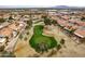 Community aerial view of the golf course community with views of the desert landscape and mountains at 25440 S Flame Tree Dr, Sun Lakes, AZ 85248