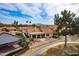 View of the property with the covered patio and awning, manicured yard, and desert landscaping at 25440 S Flame Tree Dr, Sun Lakes, AZ 85248