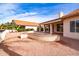 Beautiful home exterior featuring a covered patio and a well-maintained gravel yard at 25440 S Flame Tree Dr, Sun Lakes, AZ 85248