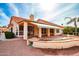 Outdoor patio with a covered awning and a manicured yard and desert landscaping at 25440 S Flame Tree Dr, Sun Lakes, AZ 85248