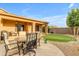 Relaxing patio with table and chairs, adjacent to the house at 25802 N Hackberry Dr, Phoenix, AZ 85083