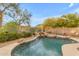 Stunning kidney-shaped pool with mountain views and waterfall feature at 25802 N Hackberry Dr, Phoenix, AZ 85083