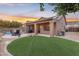 Artificial turf, covered patio, and a built-in grill at 25802 N Hackberry Dr, Phoenix, AZ 85083