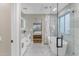 Spa-like bathroom with marble tile, soaking tub, and double vanity at 25802 N Hackberry Dr, Phoenix, AZ 85083