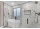 Bathroom with marble shower and freestanding bathtub at 25802 N Hackberry Dr, Phoenix, AZ 85083