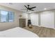 Bright bedroom with ceiling fan and closet space at 25802 N Hackberry Dr, Phoenix, AZ 85083