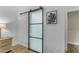 Modern sliding barn door with frosted glass panels at 25802 N Hackberry Dr, Phoenix, AZ 85083