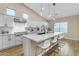 Modern kitchen with white cabinets, large island, and stainless steel appliances at 25802 N Hackberry Dr, Phoenix, AZ 85083