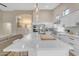 Modern kitchen with white cabinets, large island, and stainless steel appliances at 25802 N Hackberry Dr, Phoenix, AZ 85083