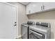 Laundry room with modern washer and dryer at 25802 N Hackberry Dr, Phoenix, AZ 85083