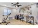 Home office with exercise bike and workspace at 25802 N Hackberry Dr, Phoenix, AZ 85083