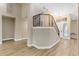 Modern staircase with black metal railing and light flooring at 25802 N Hackberry Dr, Phoenix, AZ 85083