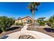 Landscaped backyard oasis with fire pit and walkway at 26907 N 51St Dr, Phoenix, AZ 85083