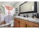 Bathroom with granite countertop, and a patterned shower curtain at 26907 N 51St Dr, Phoenix, AZ 85083