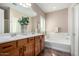 Double vanity bathroom with soaking tub and shower at 26907 N 51St Dr, Phoenix, AZ 85083