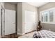 Bright bedroom with double doors and window shutters at 26907 N 51St Dr, Phoenix, AZ 85083