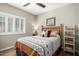 Bedroom with a queen bed, nightstand, and wooden shelving at 26907 N 51St Dr, Phoenix, AZ 85083