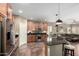 Spacious kitchen with island, stainless steel appliances, and dark countertops at 26907 N 51St Dr, Phoenix, AZ 85083