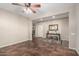 Living room featuring tile floors and a ceiling fan at 26907 N 51St Dr, Phoenix, AZ 85083