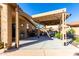 Covered patio with outdoor kitchen and seating at 26907 N 51St Dr, Phoenix, AZ 85083