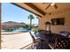 Outdoor patio with seating area and pool view at 26907 N 51St Dr, Phoenix, AZ 85083