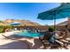 Relaxing pool area with mountain views and patio umbrellas at 26907 N 51St Dr, Phoenix, AZ 85083