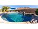 Refreshing pool with a waterfall and rock accents at 26907 N 51St Dr, Phoenix, AZ 85083