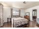 Spacious bedroom with a metal bed frame and wood floors at 2724 N Wright Way, Mesa, AZ 85215