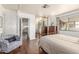 Bright bedroom with wood flooring and a view into the kitchen at 2724 N Wright Way, Mesa, AZ 85215