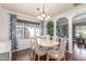 Bright dining area with hardwood floors and a six-chair table at 2724 N Wright Way, Mesa, AZ 85215