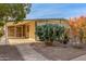 This manufactured home features a covered patio and xeriscaped front yard at 2724 N Wright Way, Mesa, AZ 85215