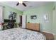 Spacious bedroom with a large bed, work area, and ceiling fan at 2981 E Nighthawk Way, Phoenix, AZ 85048