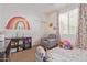 Charming bedroom with rainbow wall art, plush toys, and ample closet space at 2981 E Nighthawk Way, Phoenix, AZ 85048