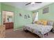 Spacious bedroom with a large bed, work area, and ceiling fan at 2981 E Nighthawk Way, Phoenix, AZ 85048