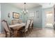 Bright dining room features a wooden table with seating for six and a large wooden cabinet at 2981 E Nighthawk Way, Phoenix, AZ 85048