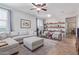 L-shaped sofa, ottoman, and built-in shelving at 2981 E Nighthawk Way, Phoenix, AZ 85048