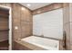 Spa-like bathroom with a large soaking tub and window at 3502 N 22 St, Phoenix, AZ 85016